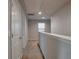 Upstairs hallway with carpet and doors leading to bedrooms at 157 Parkview Place Dr, Mcdonough, GA 30253