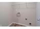Laundry room with shelving and hookups for washer and dryer at 157 Parkview Place Dr, Mcdonough, GA 30253
