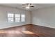 Open living room with hardwood floors and large windows at 157 Parkview Place Dr, Mcdonough, GA 30253