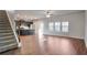 Spacious living room with hardwood floors and kitchen island visible at 157 Parkview Place Dr, Mcdonough, GA 30253