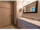 Bathroom with updated vanity and large mirror at 2341 Amberbrook Sw Dr, Conyers, GA 30094