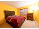 Bedroom with a dark brown upholstered bed and dresser at 2341 Amberbrook Sw Dr, Conyers, GA 30094