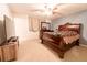 Bedroom with a sleigh bed, ceiling fan, and TV at 2341 Amberbrook Sw Dr, Conyers, GA 30094