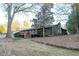 Backyard view of the house showing deck and stone wall at 2341 Amberbrook Sw Dr, Conyers, GA 30094