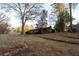 Backyard view of the house showing deck and stone wall at 2341 Amberbrook Sw Dr, Conyers, GA 30094