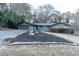Ranch home with attached garage, landscaping, and a large yard at 2341 Amberbrook Sw Dr, Conyers, GA 30094