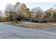 Exterior view of the house from a side street, showing yard and trees at 2341 Amberbrook Sw Dr, Conyers, GA 30094