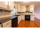 Well-equipped kitchen with updated cabinetry and flooring at 2341 Amberbrook Sw Dr, Conyers, GA 30094