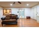 Living room with hardwood floors and French doors at 2341 Amberbrook Sw Dr, Conyers, GA 30094