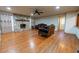 Living room with stone fireplace and hardwood floors at 2341 Amberbrook Sw Dr, Conyers, GA 30094