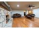 Living room features hardwood floors and a stone fireplace at 2341 Amberbrook Sw Dr, Conyers, GA 30094
