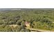 House nestled in a large wooded lot, seen from an aerial perspective at 248 Billy Bullock Rd, Dallas, GA 30157