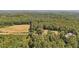 Aerial view of property showcasing a house and expansive green space at 248 Billy Bullock Rd, Dallas, GA 30157