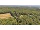 Aerial view of property showing a house near a field and forest at 248 Billy Bullock Rd, Dallas, GA 30157