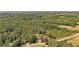 Aerial view showing a house on a spacious lot surrounded by lush greenery at 248 Billy Bullock Rd, Dallas, GA 30157