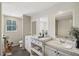 Virtually staged bathroom with double vanity and soaking tub at 248 Billy Bullock Rd, Dallas, GA 30157