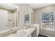 Double vanity bathroom with large window at 248 Billy Bullock Rd, Dallas, GA 30157