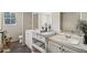 Modern bathroom with double vanity and marble top at 248 Billy Bullock Rd, Dallas, GA 30157
