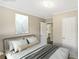Virtually staged bedroom with a queen-size bed and ensuite bathroom at 248 Billy Bullock Rd, Dallas, GA 30157