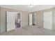 Spacious bedroom with neutral carpet and access to bathroom at 248 Billy Bullock Rd, Dallas, GA 30157