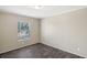 Simple bedroom with dark flooring and neutral walls at 248 Billy Bullock Rd, Dallas, GA 30157