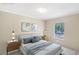 Virtually staged bedroom with a queen-size bed and nightstands at 248 Billy Bullock Rd, Dallas, GA 30157