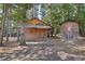 Rustic wooden cabin nestled in a wooded area at 248 Billy Bullock Rd, Dallas, GA 30157