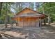 Wooden cabin with a covered porch and grill at 248 Billy Bullock Rd, Dallas, GA 30157