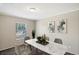 Virtually staged dining room with modern table and chairs at 248 Billy Bullock Rd, Dallas, GA 30157