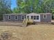 Single-story home with gray siding and a wooden deck at 248 Billy Bullock Rd, Dallas, GA 30157