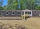Single-story home with gray siding and a wooden deck at 248 Billy Bullock Rd, Dallas, GA 30157