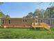 Brown single-wide manufactured home with wooden deck and steps at 248 Billy Bullock Rd, Dallas, GA 30157