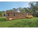 Brown single-wide manufactured home with wooden deck and steps at 248 Billy Bullock Rd, Dallas, GA 30157