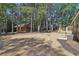 Mobile home with deck and view of cabin and outhouse at 248 Billy Bullock Rd, Dallas, GA 30157