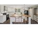 Modern kitchen with white cabinets and an island at 248 Billy Bullock Rd, Dallas, GA 30157