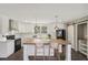 Virtually staged kitchen with white cabinets, island, and modern appliances at 248 Billy Bullock Rd, Dallas, GA 30157