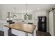 Modern kitchen with white cabinets, large island, and black appliances at 248 Billy Bullock Rd, Dallas, GA 30157