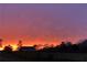 Vibrant sunset over field with barn in distance at 248 Billy Bullock Rd, Dallas, GA 30157