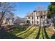 Spacious backyard with playground, patio, and large lawn area at 1429 Wood Iris Ln, Lawrenceville, GA 30045
