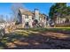 Large backyard with playset, patio, and wooden fence at 1429 Wood Iris Ln, Lawrenceville, GA 30045