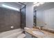 Bathroom with tub, shower, and granite vanity at 1429 Wood Iris Ln, Lawrenceville, GA 30045