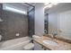 Bathroom with tub, shower, and granite vanity at 1429 Wood Iris Ln, Lawrenceville, GA 30045