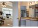 Bathroom with vanity and access to bedroom and office at 1429 Wood Iris Ln, Lawrenceville, GA 30045