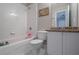 Bathroom with tub, shower, and granite vanity at 1429 Wood Iris Ln, Lawrenceville, GA 30045