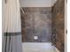 Bathroom with shower/tub combo and tile surround at 1429 Wood Iris Ln, Lawrenceville, GA 30045