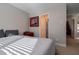 Bright bedroom with large bed and window coverings at 1429 Wood Iris Ln, Lawrenceville, GA 30045