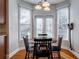 Bright breakfast nook with table and chairs, and access to backyard at 1429 Wood Iris Ln, Lawrenceville, GA 30045