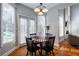 Sunlit breakfast nook with table and chairs, and view to the backyard at 1429 Wood Iris Ln, Lawrenceville, GA 30045