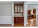 Built-in cabinet with glass doors in dining area at 1429 Wood Iris Ln, Lawrenceville, GA 30045