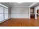 Formal dining room with hardwood floors and wainscoting at 1429 Wood Iris Ln, Lawrenceville, GA 30045
